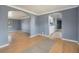 Inviting living room featuring hardwood floors and an arched doorway, creating a cozy and open atmosphere at 2280 S Decatur St, Denver, CO 80219