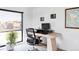 Home office with standing desk and large window at 1286 S Pennsylvania St, Denver, CO 80210