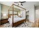 Bedroom featuring a cozy bed, modern ceiling fan, carpet floor, and a closet at 6776 Navajo Way, Denver, CO 80221