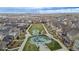 Aerial view of a neighborhood park, featuring playground and landscaped areas at 6776 Navajo Way, Denver, CO 80221