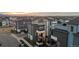 Aerial view of modern townhouses featuring balconies and rooftop decks in a well-planned community at 6776 Navajo Way, Denver, CO 80221