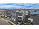 Aerial view of modern townhomes with multiple balconies and stylish exteriors at 6776 Navajo Way, Denver, CO 80221