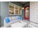 Relax on the patio with comfortable seating and a view through the large window at 6776 Navajo Way, Denver, CO 80221