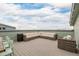 Relax on the rooftop deck featuring comfortable outdoor seating with a view at 6776 Navajo Way, Denver, CO 80221