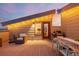 Enjoy the expansive rooftop patio with a dining table, grill, and string lights at 6776 Navajo Way, Denver, CO 80221