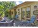 Cozy back porch with seating, lush vegetation and decor at 901 S Leyden St, Denver, CO 80224