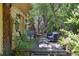 Cozy back porch with seating, lush vegetation and decor at 901 S Leyden St, Denver, CO 80224