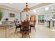 Dining room featuring a decorative chandelier, skylights, and an adjacent living space at 901 S Leyden St, Denver, CO 80224