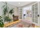 Entryway featuring a vintage rug, french doors, and a view of the adjacent kitchen at 901 S Leyden St, Denver, CO 80224
