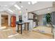 Open kitchen with skylights, stainless steel appliances, and adjacent dining area at 901 S Leyden St, Denver, CO 80224