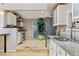 Modern kitchen with granite countertops, stainless steel appliances, and natural light at 901 S Leyden St, Denver, CO 80224