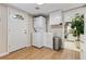 Convenient laundry room with full-size stackable washer and dryer, storage and easy access to the kitchen at 901 S Leyden St, Denver, CO 80224