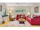 Inviting living room featuring hardwood floors, bright windows, comfortable seating, and stylish decor at 901 S Leyden St, Denver, CO 80224