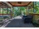 Covered patio with brick flooring and comfortable seating offers a perfect space for relaxation and outdoor dining at 901 S Leyden St, Denver, CO 80224