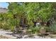 Landscaped yard with walkway, large planters and tranquil garden at 901 S Leyden St, Denver, CO 80224