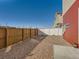 The backyard is private with a wood and white fence surrounding the gravel yard at 4987 N Walden Way, Denver, CO 80249