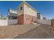 The backyard features a combination of wood and white fencing, along with low maintenance gravel at 4987 N Walden Way, Denver, CO 80249