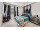 Bedroom with neutral carpet and ample natural light at 4987 N Walden Way, Denver, CO 80249