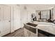 Modern kitchen features a stainless steel farmhouse sink and plenty of counter space at 4987 N Walden Way, Denver, CO 80249