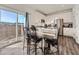 Open concept kitchen and dining area with stainless steel appliances and plenty of cabinet space at 4987 N Walden Way, Denver, CO 80249