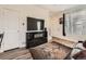 Stylish living room with modern decor, wood floors, and bright, natural light at 4987 N Walden Way, Denver, CO 80249