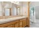 Well-lit bathroom with double sink vanity, and a shower/tub combination, offering both style and functionality at 1967 Haystack Rd, Castle Rock, CO 80104
