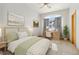 Serene bedroom with large picture window, decorated with light green and white colors, complete with a desk area at 1967 Haystack Rd, Castle Rock, CO 80104