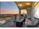 Outdoor living space with a fire pit and beautiful views, perfect for entertaining guests at 1967 Haystack Rd, Castle Rock, CO 80104