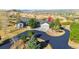 Stunning home boasts a circular driveway and professional landscaping, set against a picturesque mountain backdrop at 1967 Haystack Rd, Castle Rock, CO 80104