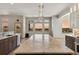 Modern kitchen with a large center island, stainless appliances, and scenic views at 1967 Haystack Rd, Castle Rock, CO 80104