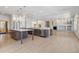 Expansive kitchen with stainless appliances, a center island, and an open floor plan at 1967 Haystack Rd, Castle Rock, CO 80104