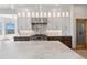 Gourmet kitchen features tile backsplash, stainless appliances, and custom cabinets at 1967 Haystack Rd, Castle Rock, CO 80104