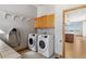 Well-equipped laundry room with modern washer and dryer appliances at 1967 Haystack Rd, Castle Rock, CO 80104