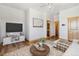 Comfortable living room with hardwood floors, a ceiling fan, and neutral-colored walls at 1967 Haystack Rd, Castle Rock, CO 80104
