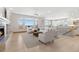 Bright living room has a fireplace, lots of windows, hardwood floors, and an open layout at 1967 Haystack Rd, Castle Rock, CO 80104