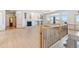 The living room showcases large windows, hardwood floors, and fireplace at 1967 Haystack Rd, Castle Rock, CO 80104
