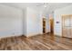 Bright living room features wood floors, a ceiling fan, and natural light at 1967 Haystack Rd, Castle Rock, CO 80104