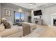 Comfortable main bedroom with a fireplace, large screen tv, balcony, and neutral decor, creating a relaxing atmosphere at 1967 Haystack Rd, Castle Rock, CO 80104