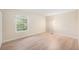 Bright bedroom with hardwood flooring, large window, and ample natural light at 10251 W 44Th Ave # 3-204, Wheat Ridge, CO 80033