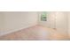 Bright bedroom with hardwood flooring and a large window filling the room with natural light at 10251 W 44Th Ave # 3-204, Wheat Ridge, CO 80033