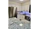 Bright kitchen featuring stainless steel fridge and modern appliances, with beautiful granite countertops at 10251 W 44Th Ave # 3-204, Wheat Ridge, CO 80033