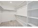 Spacious walk-in closet with custom shelving at 39621 Congress Ln, Elizabeth, CO 80107