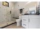 Bathroom featuring glass-enclosed shower, and white vanity with black accents at 1100 S Elizabeth St, Denver, CO 80210