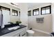 Powder room featuring a sleek vanity, modern fixtures, and natural light at 1100 S Elizabeth St, Denver, CO 80210