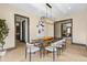 Airy dining room featuring modern decor and ample natural light; great for entertaining at 1100 S Elizabeth St, Denver, CO 80210