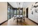 Elegant dining room with large windows, stylish light fixture, and seating for eight at 1100 S Elizabeth St, Denver, CO 80210