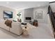 Bright living room with plush seating, a fireplace, and large windows providing ample natural light at 1100 S Elizabeth St, Denver, CO 80210
