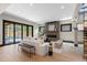 Bright living room with hardwood floors, fireplace, and large sliding doors that lead to the outdoor area at 1100 S Elizabeth St, Denver, CO 80210