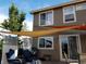 Outdoor living area with patio furniture, grill, string lights and shade covering at 5211 E 116Th Ave, Thornton, CO 80233