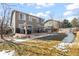 Backyard deck with dining set, grill, and hot tub create an ideal outdoor living space at 5211 E 116Th Ave, Thornton, CO 80233